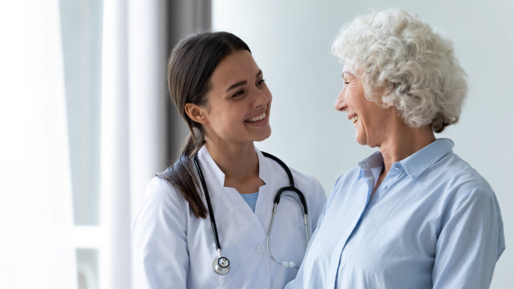 Smiling,Caring,Young,Female,Nurse,Doctor,Caretaker,Assisting,Happy,Senior