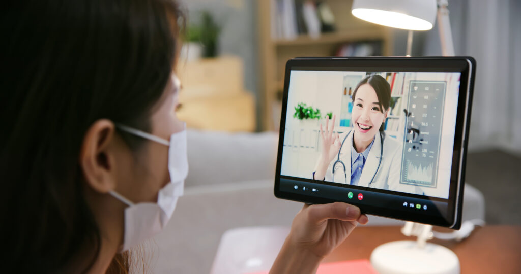 Telemedicine,Concept,-,Asian,Female,Patient,Listening,To,Male,Doctor